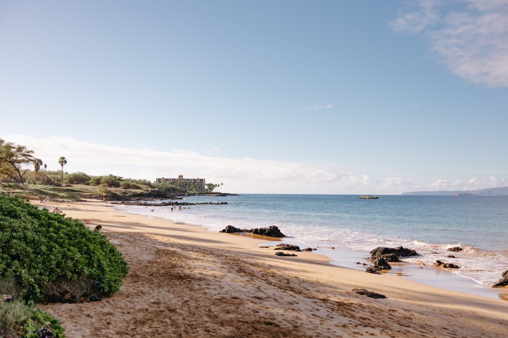 Scenic Maui beach, highlighting guest support and concierge services.